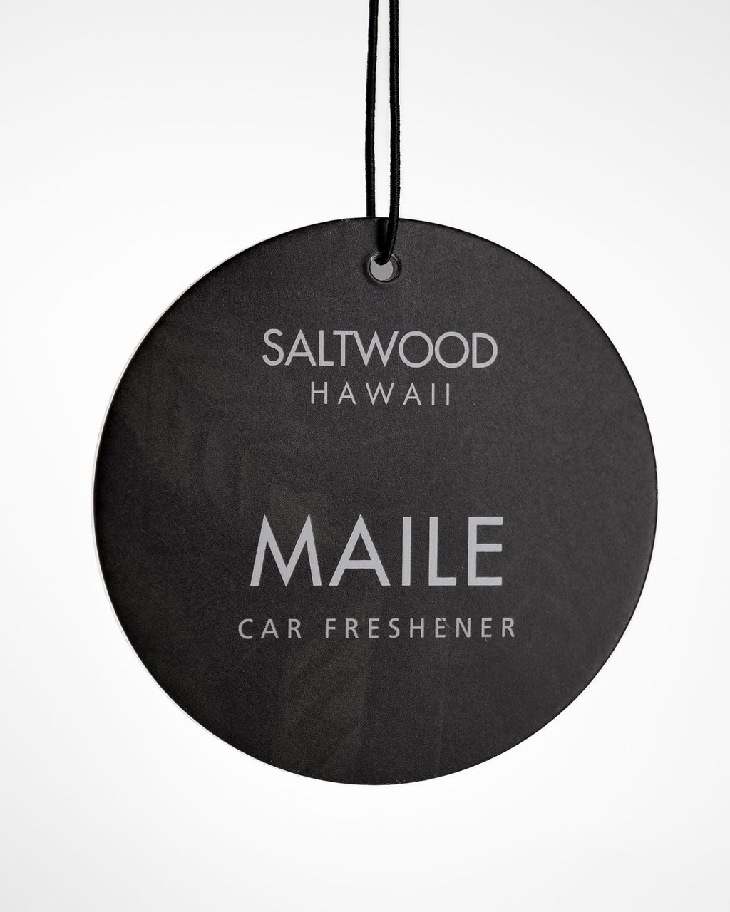 Saltwood Hawaii Maile car freshener hanging against a white background